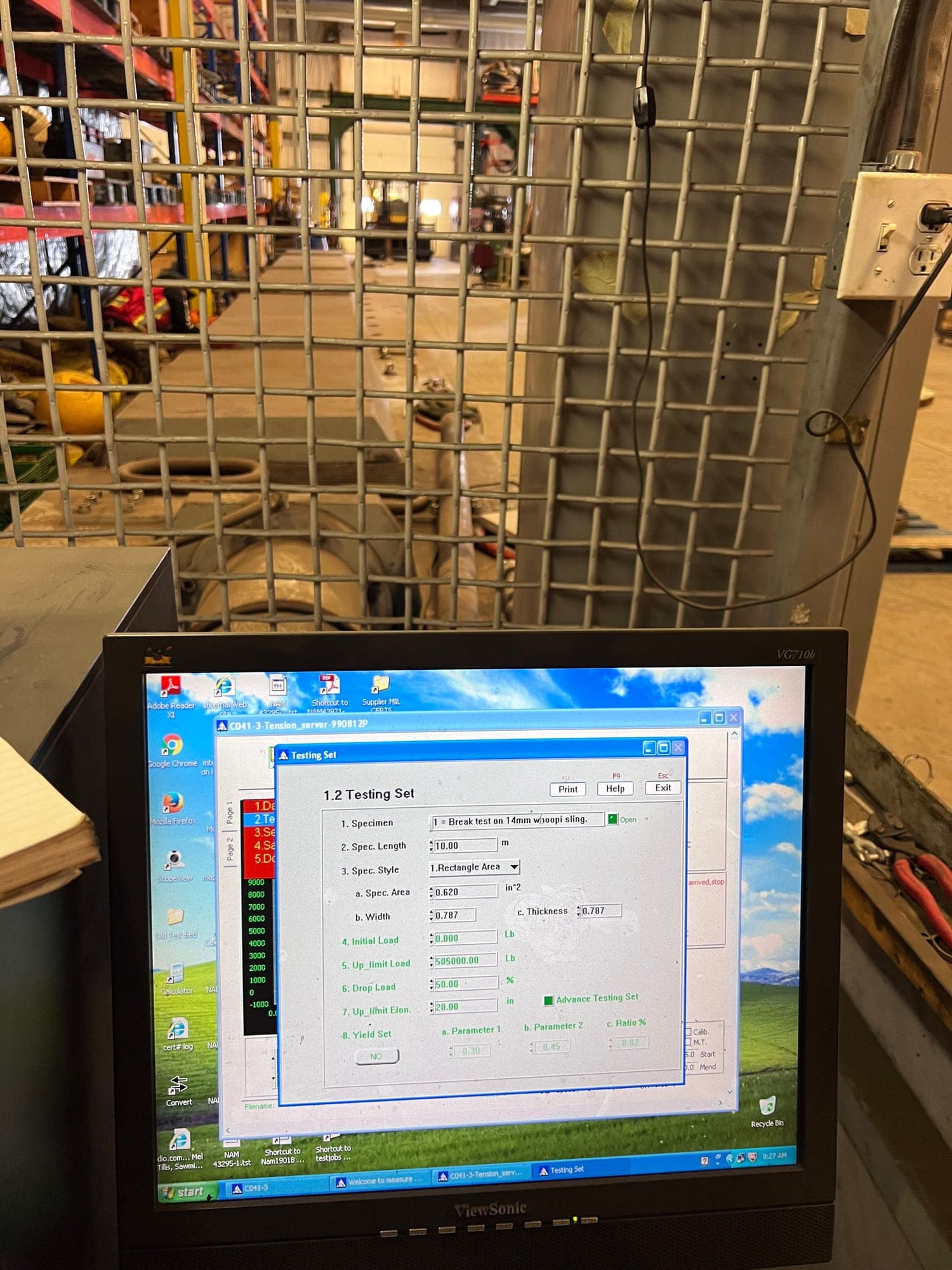 The test bed controller with a run being set up on screen — specimen, length and load limits entered, the load trace alongside